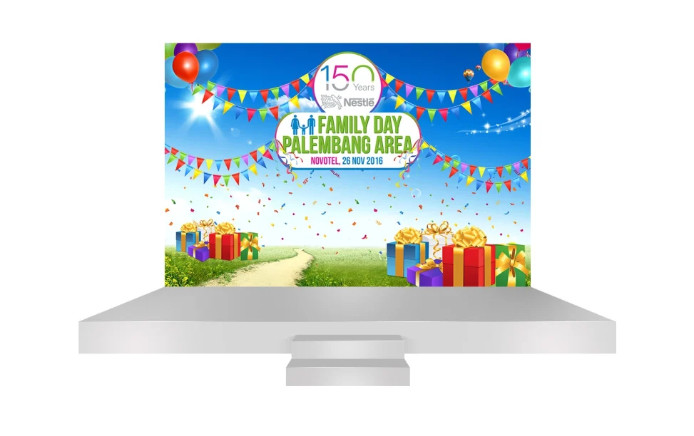 Desain backdrop panggung Nestlé Family Day Palembang Area di Novotel dengan tata letak visual perayaan yang ceria dan profesional.