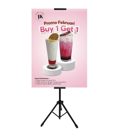 Desain standing banner Promo Februari Buy 1 Get 1 Jamu Kopi Palembang menampilkan penawaran spesial minuman dengan syarat dan ketentuan lengkap.